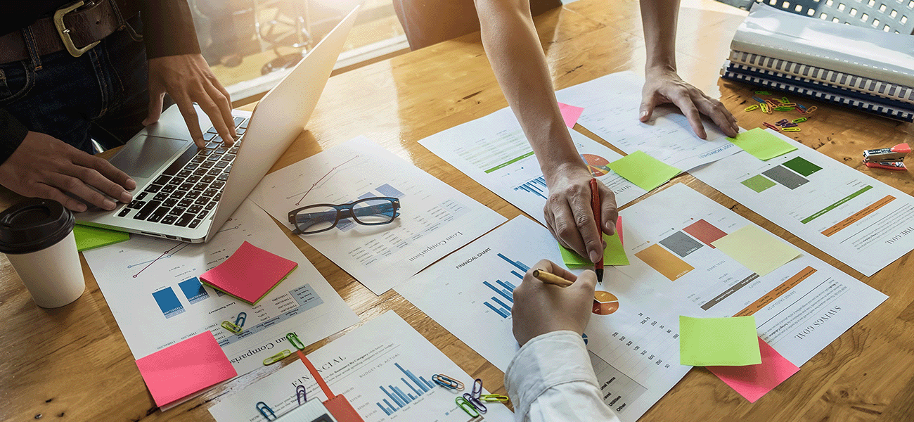 A group of administrators working out a budget.