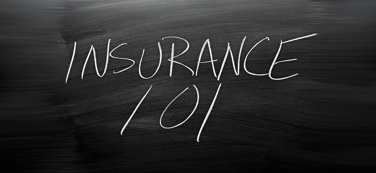 Insurance 101 written out on a chalkboard.