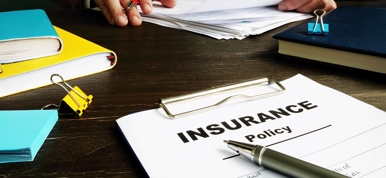 An insurance policy sitting on a desk.