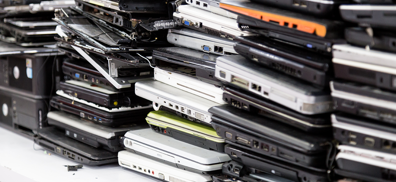 Stack of damaged laptops.
