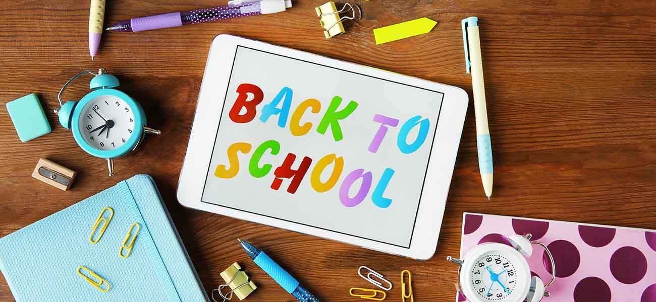 Tablet on a desk with a vibrant 'Back to School' display.