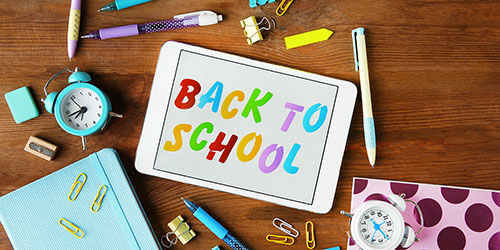 Image: Tablet on a desk with a vibrant 'Back to School' display.