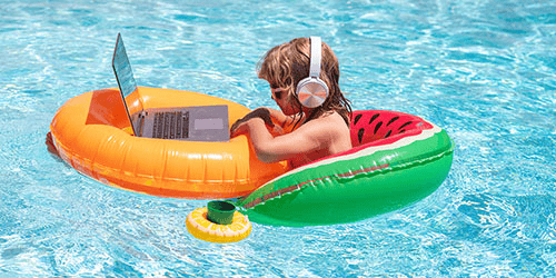 Kid in Pool With Laptop and Headphones